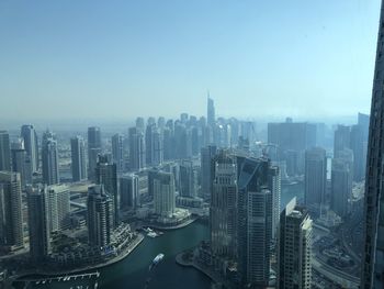 High angle view of buildings in city against clear sky