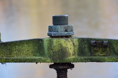 Close-up of metal structure against sky