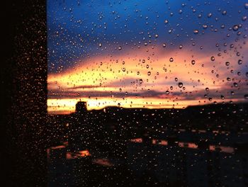 Full frame shot of wet glass window in rainy season