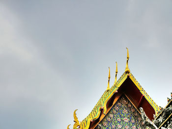 Low angle view of temple against building