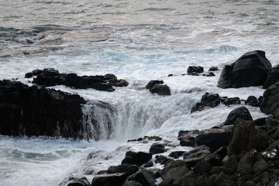 Waves splashing on rocks