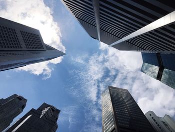 Low angle view of building against cloudy sky