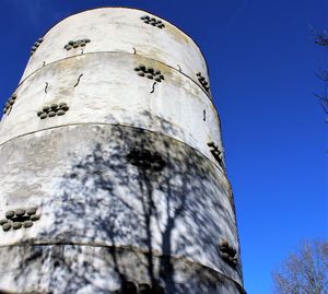 Low angle view of abandoned building against clear sky