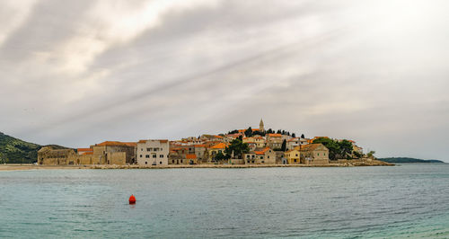 Scenic view of old town on seashore