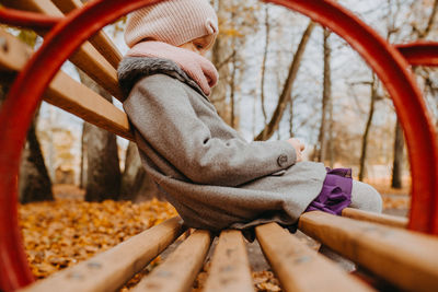 Low section of boy on bicycle at playground