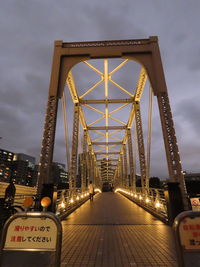 View of bridge against cloudy sky