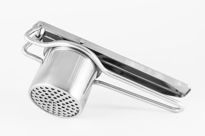 Close-up of metal over white background