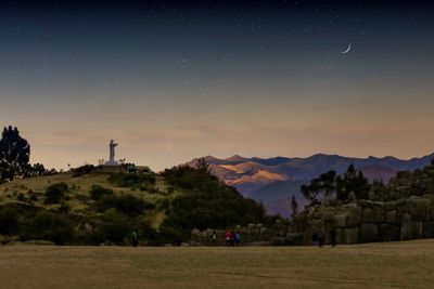 Scenic view of field against sky at night