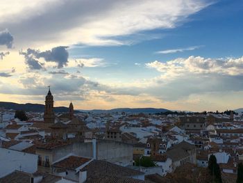 Town against cloudy sky