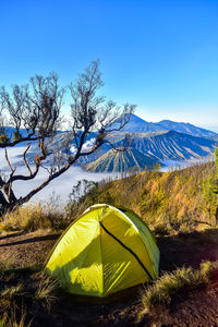 Scenic view of mountains against clear blue sky