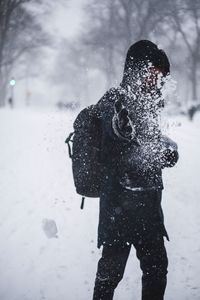 Shadow of woman standing on frozen field