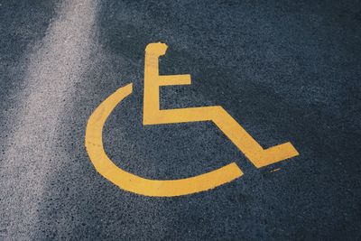 High angle view of disability sign on road