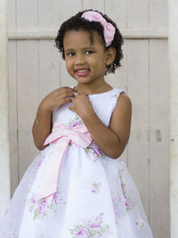 Portrait of smiling girl wearing dress