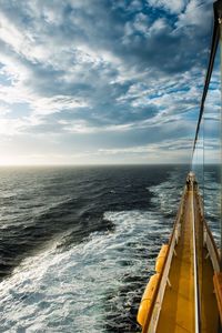 Scenic view of sea against cloudy sky