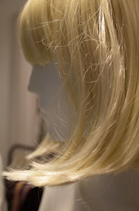 Close-up of mannequin with blond hair wig