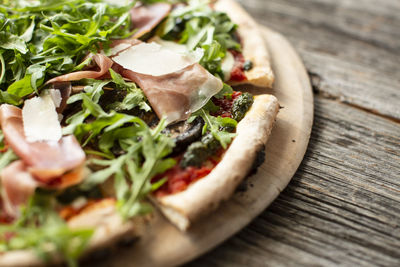 Close-up of pizza served on table