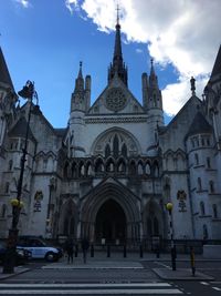Facade of historic building against sky in city