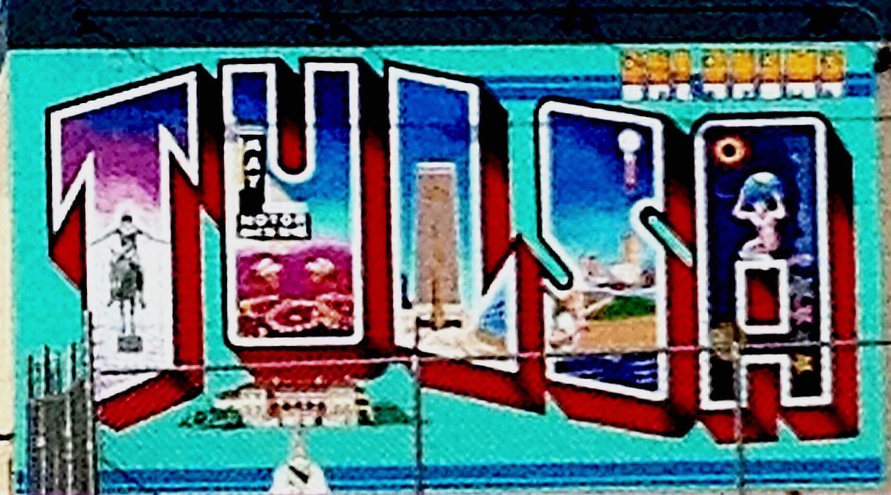 graffiti, text, art, creativity, art and craft, communication, western script, wall - building feature, multi colored, blue, built structure, architecture, human representation, capital letter, wall, building exterior, street art, sign, vandalism