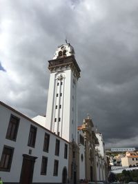 Low angle view of historical building against cloudy sky