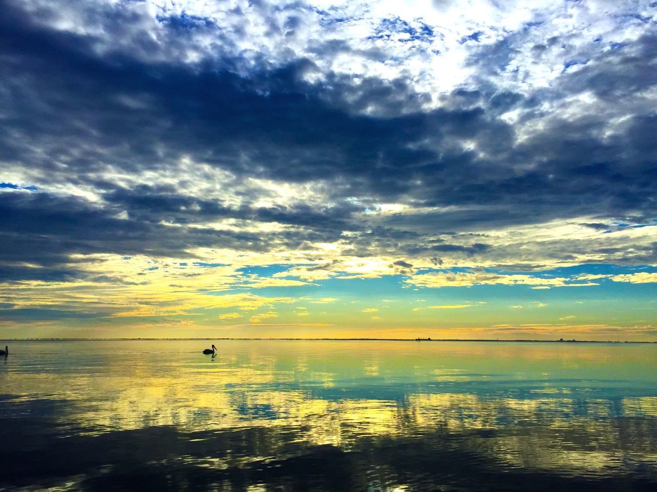 sky, water, cloud - sky, sea, sunset, scenics, tranquil scene, cloudy, beauty in nature, horizon over water, tranquility, cloud, beach, nature, reflection, idyllic, weather, shore, dramatic sky, silhouette