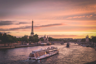 High angle view of boat in river against orange sky