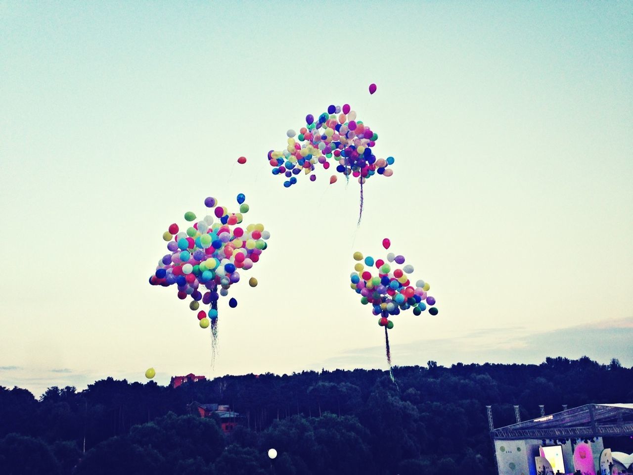 clear sky, multi colored, copy space, blue, sky, balloon, colorful, low angle view, celebration, variation, nature, beauty in nature, outdoors, large group of people, flower, decoration, mountain, day, landscape, scenics