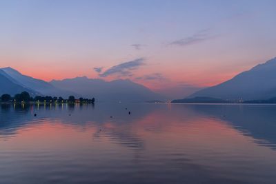 Scenic view of lake against sky during sunset