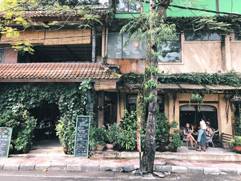 People sitting outside building