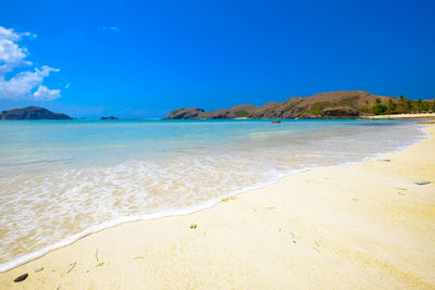 Scenic view of sea against blue sky