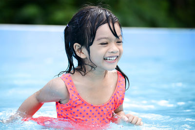 Close-up of playful girl at water park