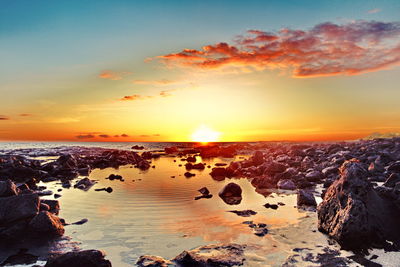 Scenic view of sea against sky during sunset