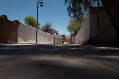 Surface level of road against clear sky