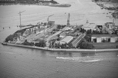 High angle view of buildings by sea