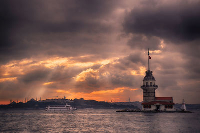 Scenic view of sea and buildings against sky during sunset. kiz kulesi or maiden's tower..