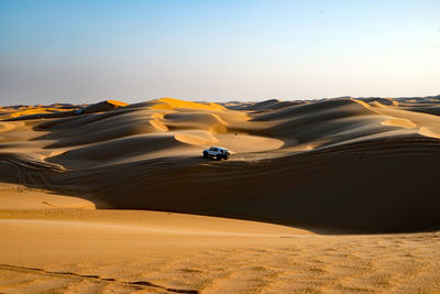 Scenic view of desert against clear sky