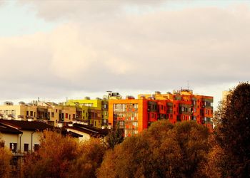High angle view of buildings in town against sky