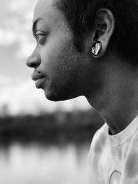 Close-up portrait of young man looking away