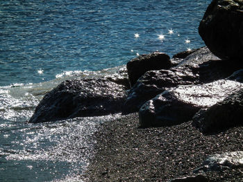 Close-up of person with sea in background