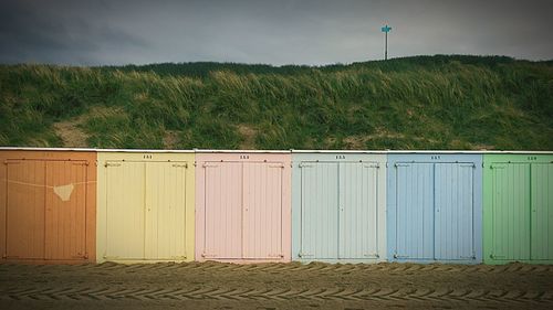 Multi colored huts on beach