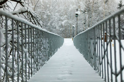 Footbridge over footpath during winter