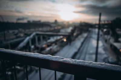 High angle view of railroad tracks against sky during sunset