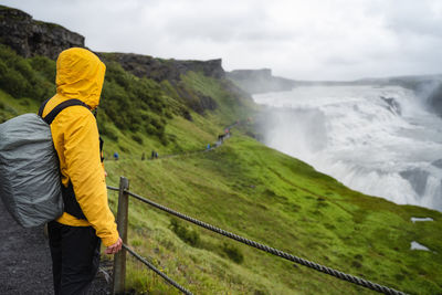 Rear view of man standing on mountain