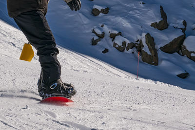 Snowboarder detail on a ski slope