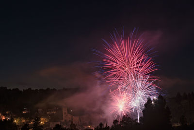 Fireworks against sky at night