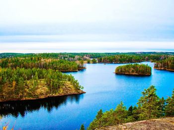 Scenic view of lake against cloudy sky