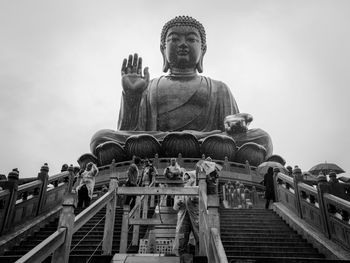 Low angle view of statue against sky