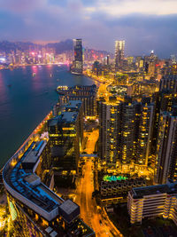 High angle view of illuminated buildings in city at night