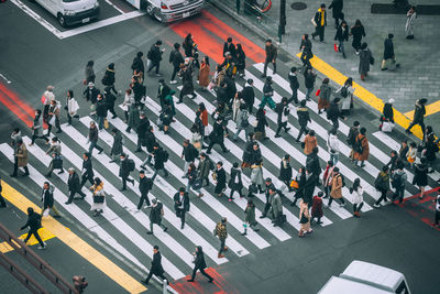 High angle view of people crossing road