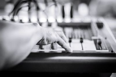 Close-up of person using sound mixer