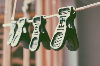 Close-up of clips hanging on wall